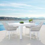 Set of four Miami Dining Chairs around white square outdoor table by pool with mountain backdrop