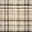 Narrow runner rug with ivory background and plaid stripes on wood floor