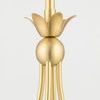 Close-up detail of gold floral accent with spherical base connecting chandelier arms