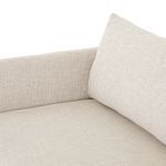 Side angle showing seat cushion and back pillow corner with textured fabric