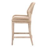 Side view emphasizing the open woven design between armrest and seat cushion