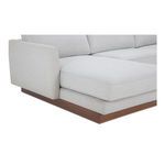 Close-up of Vernon sectional corner featuring wooden base detail and fabric texture