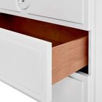 Partial drawer open showing natural wood interior contrasting the white lacquer exterior