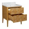 Close-up of front left corner showing drawer surround and marble countertop edge