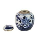 Blue and white jar with lid removed placed beside it at close angle
