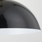 Close-up of glossy black pendant shade showing smooth reflective surface and white interior