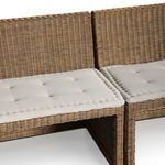 Dining room setup with Senna Banquette around wood oval table and neutral wall art