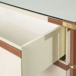 Open drawer revealing smooth cream-colored interior with soft-close undermount hardware