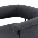 Back view focusing on yoke backrest curvature and slim tubular frame design