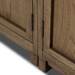 Distinct center bottom join detail of double cabinet where two sections meet
