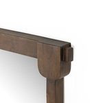 Detailed close-up of top corner showing thick wood frame with rounded edges and natural grain