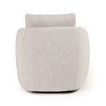 Close-up of armrest corner with fabric folds emphasizing plush padding