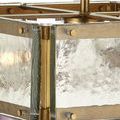 Close-up of thick cast glass panes and gold screws on the semi-flush mount ceiling light