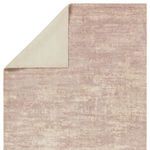 Top view with corner flipped over revealing sturdy cream-colored backing