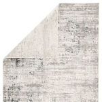 Rug flipped to show reverse side with lighter, smoother backing texture
