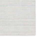 Close-up of rug surface showing fine textural stripe details.