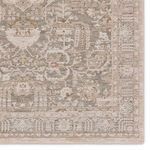 Detailed section of the edge highlighting intricate scrolling patterns in beige and gray shades