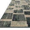 Side angle view of the rug showing low pile texture and thin edge binding