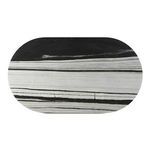 Overhead view revealing black and white panda marble pattern across the Celia Oval Dining Table’s surface