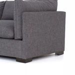 Close-up of Westwood sectional armrest showing knife edge fabric details and square wooden foot