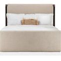 Front-facing view highlighting upholstered beige fabric on headboard and footboard with dark wood frame posts