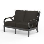 Monterey Loveseat with dark espresso aluminum frame featuring organic curved arms and plush black cushions