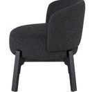 Side profile of Adelaide chair showing thick boucle fabric and slanted backrest
