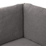 Close-up corner junction of back cushions showing tight fabric seams and plush padding
