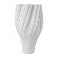 Tall white porcelain vase with an elegant twisted vertical ribbed design and a narrow base widening at the top