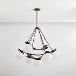 Duxbury Chandelier hanging from ceiling, view showing full fixture in room context against plain wall