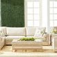 Outdoors living set styling with side table placed at sofa corner and wicker armchair, accented by indoor greenery