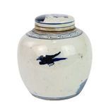 Side back view with lid on showing small blue bird and smooth white surface