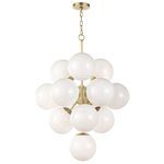 White swirl glass chandelier suspended against a black background without illumination