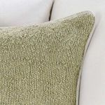 Close-up of pillow corner with visible light-colored piping detail