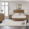 Same bedroom setup with nightstand and dresser showing alternative metal finish on dresser handles