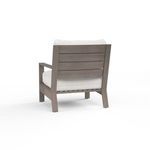 Rear view showing Laguna Club Chair's driftwood aluminum slatted backrest design