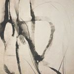 Close-up focusing on the faded black strokes and delicate lines on canvas texture