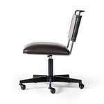 Wharton chair shown in workspace environment with hardwood floors and bookshelf background
