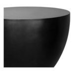 Close-up of the table’s smooth concrete texture and rounded edge