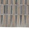 Close-up of tan and gray mosaic pattern highlighting textured PET material and varied color sections