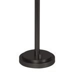 Dark round metal base of lamp with small cylindrical switch detail