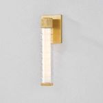 Castor Bath Sconce illuminated with integrated LED showing warm, icy glow through ridged glass tubes
