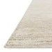 Close-up angled view showing Serena Ivory Rug’s low pile with subtle linear texture and soft shimmer.