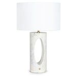 Portia Marble Table Lamp with white marble base featuring lavender veining, oval cutout, brass knob, and natural linen shade