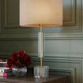 Close-up of clear optic crystal cylinder and disc base of the Deville Table Lamp with visible metal details