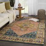 Traditional rug styled in living room with white sofa, side table, pouf, and natural light