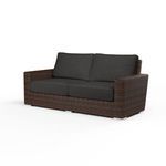 Montecito Loveseat in Cognac multi-colored resin wicker with black cushions, sleek modern outdoor sofa design