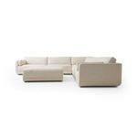Sectional from right-side corner angle showing ottoman and two rounded armrests