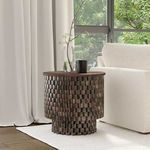 Norwood round end table styled next to a white sofa on a textured rug by a large window