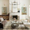 Francis Rug in living room under glass coffee table and dark brown sofa with fireplace background